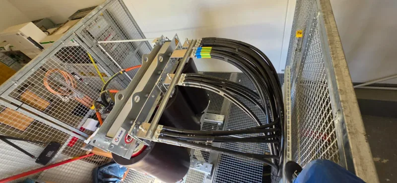 SGB cast resin dry-type transformer inside protective cage enclosure