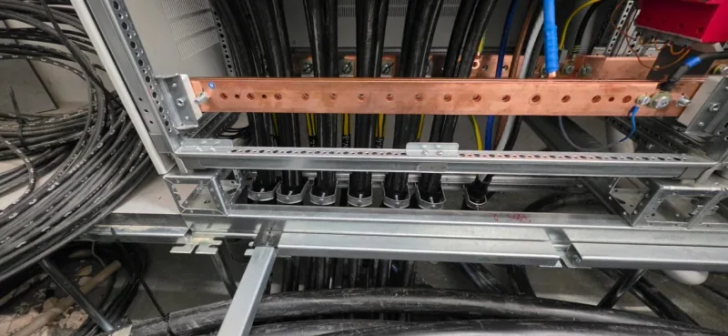 Copper busbars and cable restraint rails at the base of the NSHV enclosure